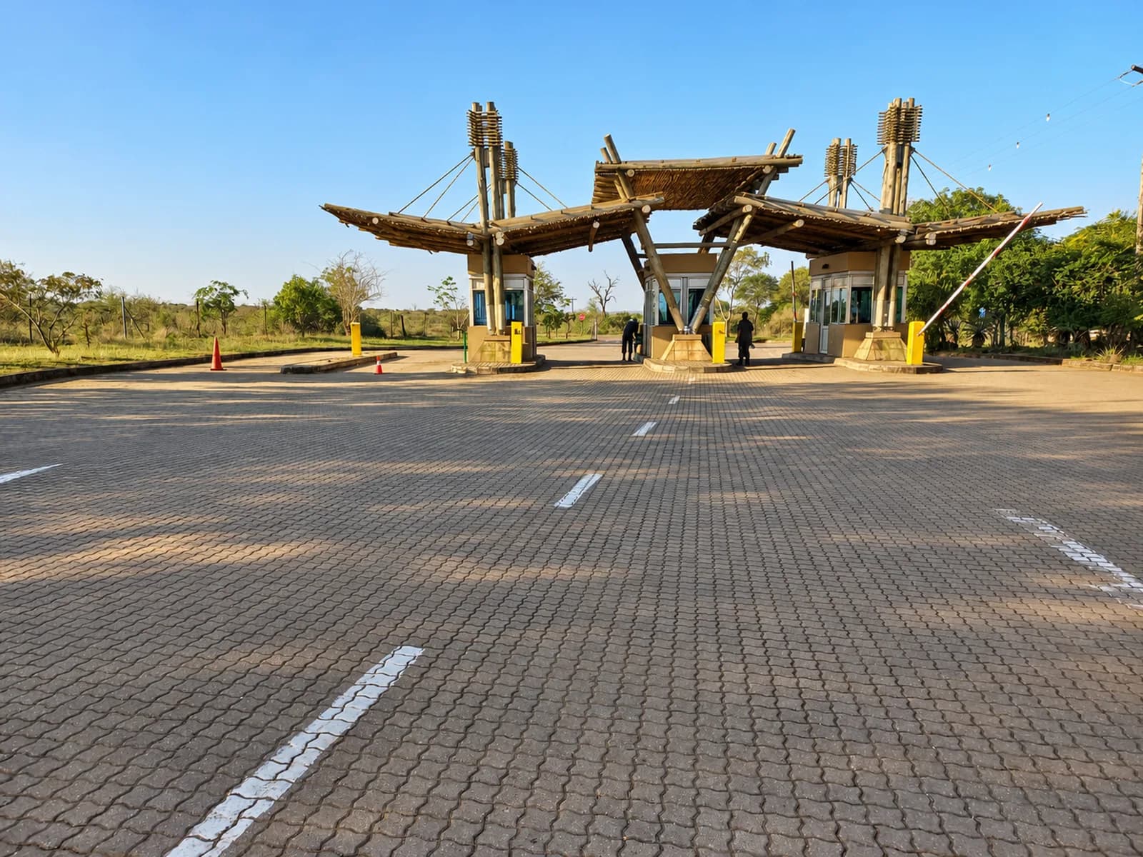 The paved approach to the timber entrance at Crocodile Bridge Gate
